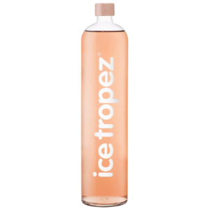 Ice Tropez 1L - lekko musujący koktajl na bazie wina z regionu Prowansja. Aromatyzowany sokiem z białej brzoskwini, kwiatów nektarynki oraz czerwonych owoców. W szklanej przezroczystej butelce. O bladoróżowych barwie z jasnymi refkleksami.